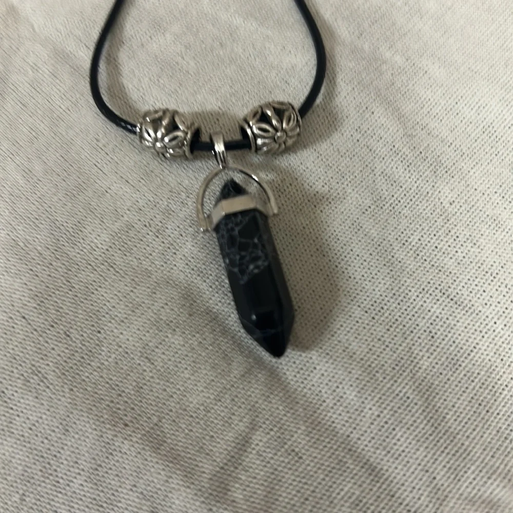 This black stone with white swirls is highly blessed - Picture 2 of 3